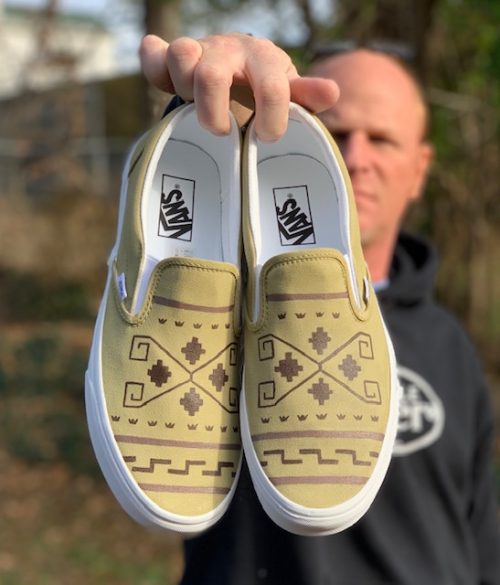 Van shoes that are custom painted to look like the Dude sweater from the Big Lebowski
